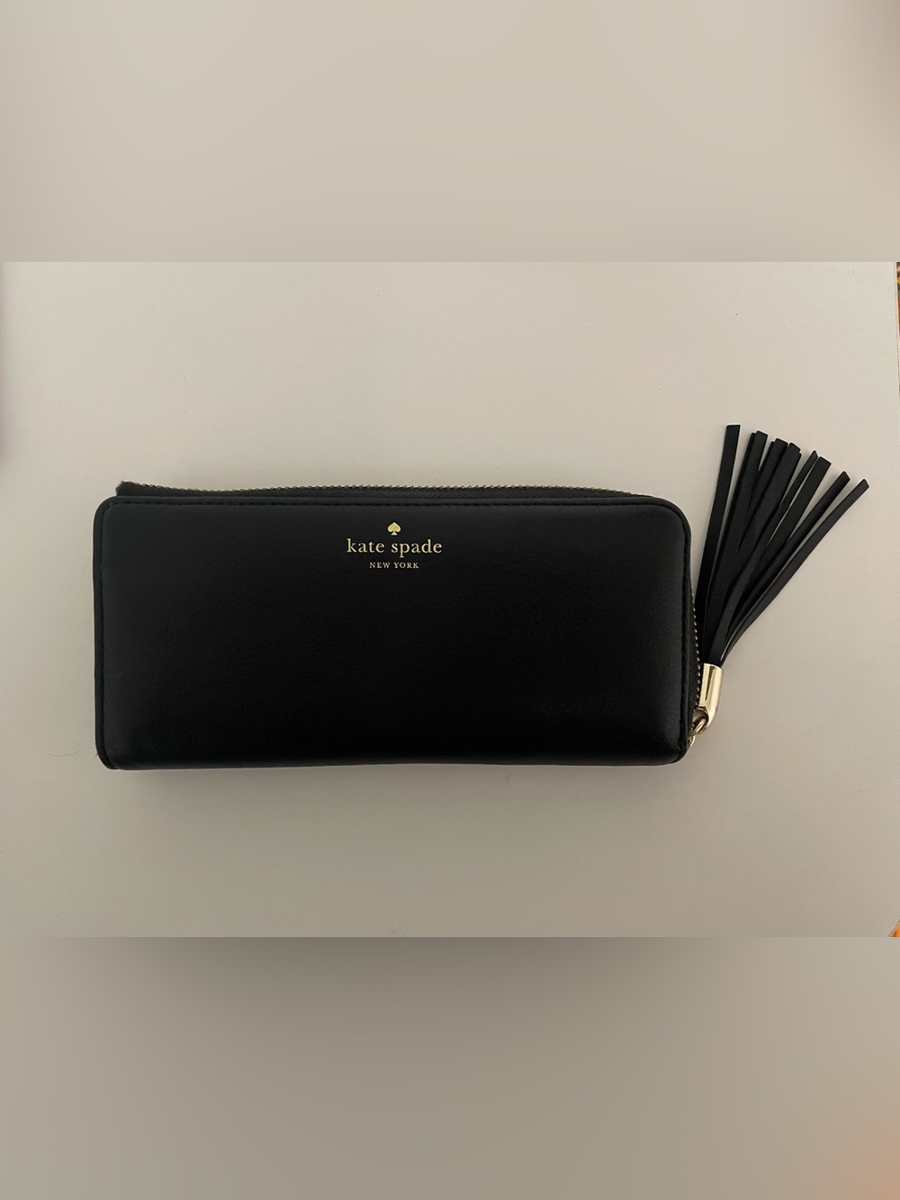 kate spade Black Leather Zip-Around Wallet with Tassel